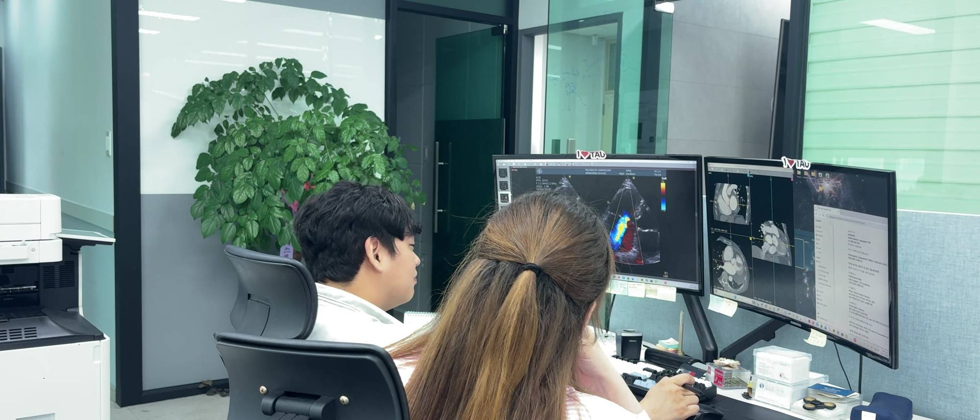 Physicians reviewing cardiac imaging together